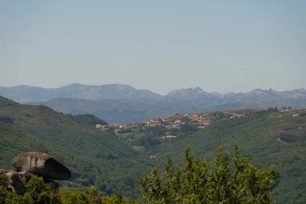 View of Geres national park mountains with a village on the foreground in Fafe, Portugal