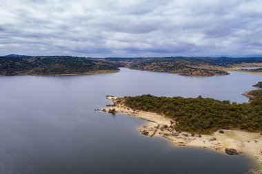 Drone aerial view of Idanha Dam Marechal Carmona landscape with beautiful blue lake water, in Portugal