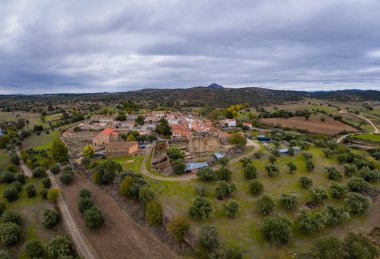 Drone aerial view of Idanha a velha historic village and landscape with Monsanto on the background, in Portugal