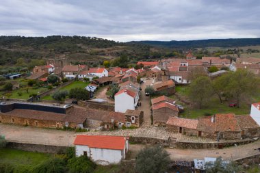 Drone aerial view of Idanha a velha historic village and landscape with Monsanto on the background, in Portugal