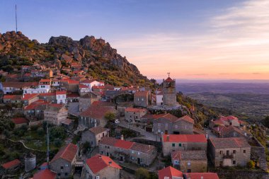 Drone aerial panorama view of Monsanto historic village at sunset, in Portugal clipart