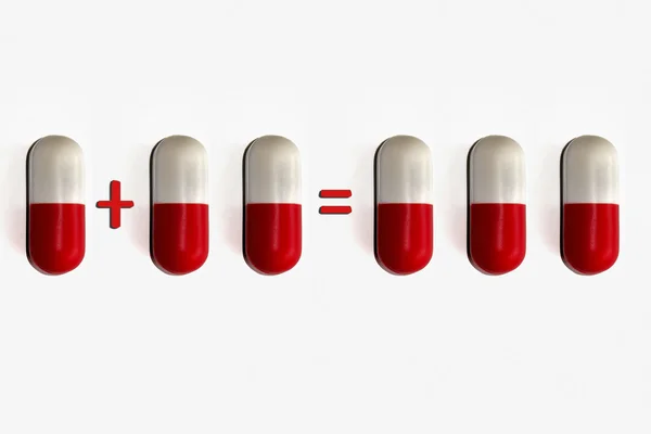 Comprimido vermelho e branco fundo isolado no branco — Fotografia de Stock
