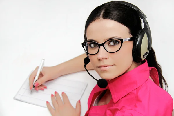 Representante de servicio al cliente femenina con auriculares —  Fotos de Stock