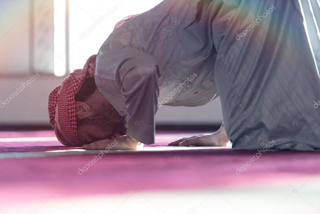 Muslim Arabic man praying. Religious muslim man praying inside the mosque during ramadan