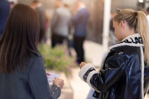 Conference Staff Member scan a QR code from attendee upon arrival to check-in site