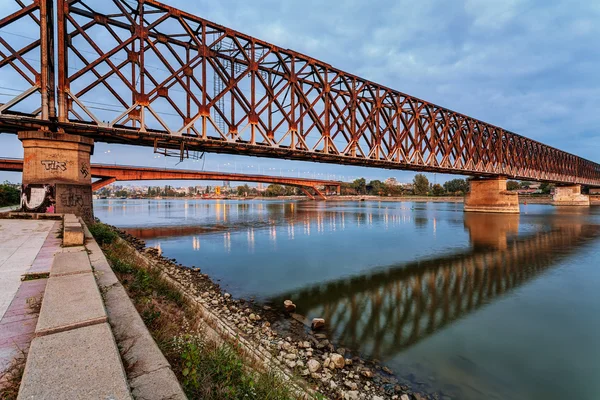 Steel bridge across river at night — Stock Photo, Image