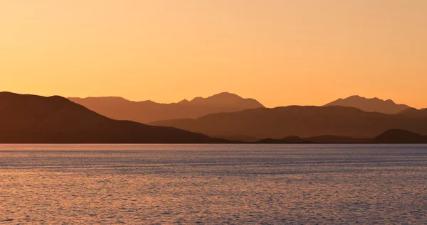 Soluppgång vid havet Stockfoto