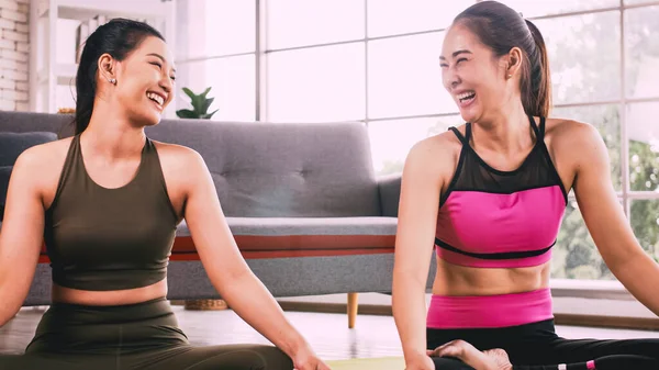 Two Asian Girls Doing Yoga Exercises Home —  Fotos de Stock