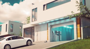 A concept for a home battery system for solar energy storage and powering electric vehicles. A modern house with an open garage and a car in the afternoon light. 3d rendering. clipart