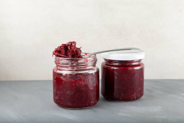 Fried beets in glass  jars. Delicious ingredient for vegetarian salads or borscht. Stewed beetroot.