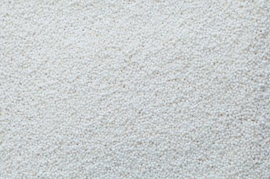 Tapyoka incileri ya da sago topları, yakın plan. Geçmişi. Beyaz Tapyoka topları balonlu çay, boba içecekleri ve içecek kokteylleri için kullanılır..