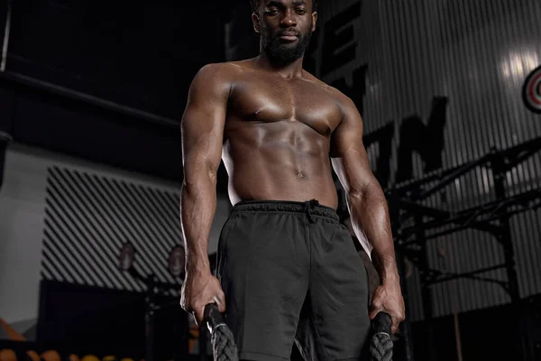 Workout. Crossfit. Extreme. Training. Afro shirtless muscular man posing at camera