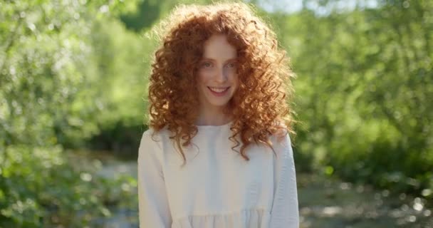 Fairy tale. redhead curly female in mystery forest near lake, enjoying time in nature — Stock Video