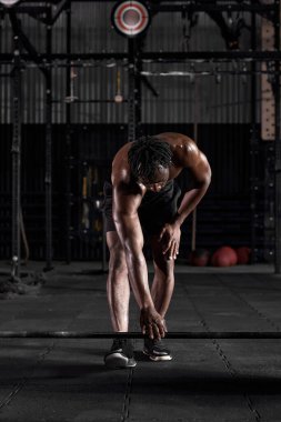 handsome strong african bodybuilder athletic fitness man pumping up abs muscles