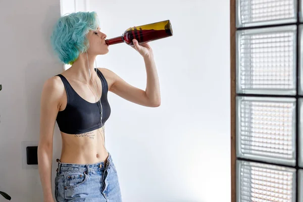 Sad frustrated woman with wine suffering from depression, loneliness and stress — Stock Photo, Image