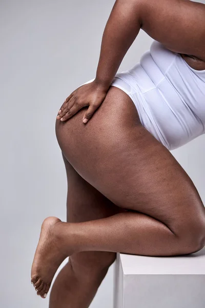 Plus Size Model. Woman Hips Close Up. Cropped Female In White Bodysuit, Posing On Gray Studio — Φωτογραφία Αρχείου