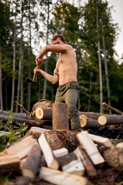 Working hard. firewood at campsite. camping and hiking. outdoor activity. muscular lumberjack — Stock Photo, Image