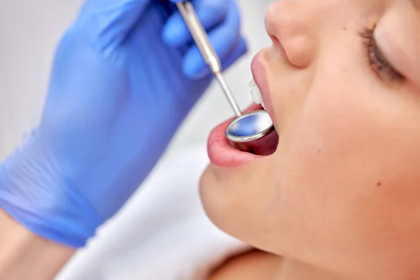 Side view close up portrait of cute child girl getting dental checkup at dentistry — Stock Photo, Image