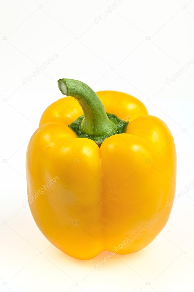 sweet yellow bell pepper on a white background illuminated