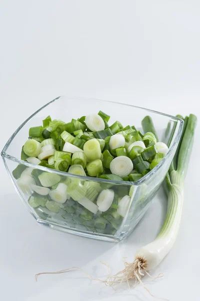 Spring onions, whole and sliced — Stock Photo, Image