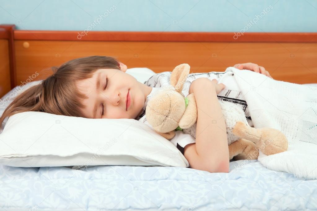 The sleeping boy with soft toy