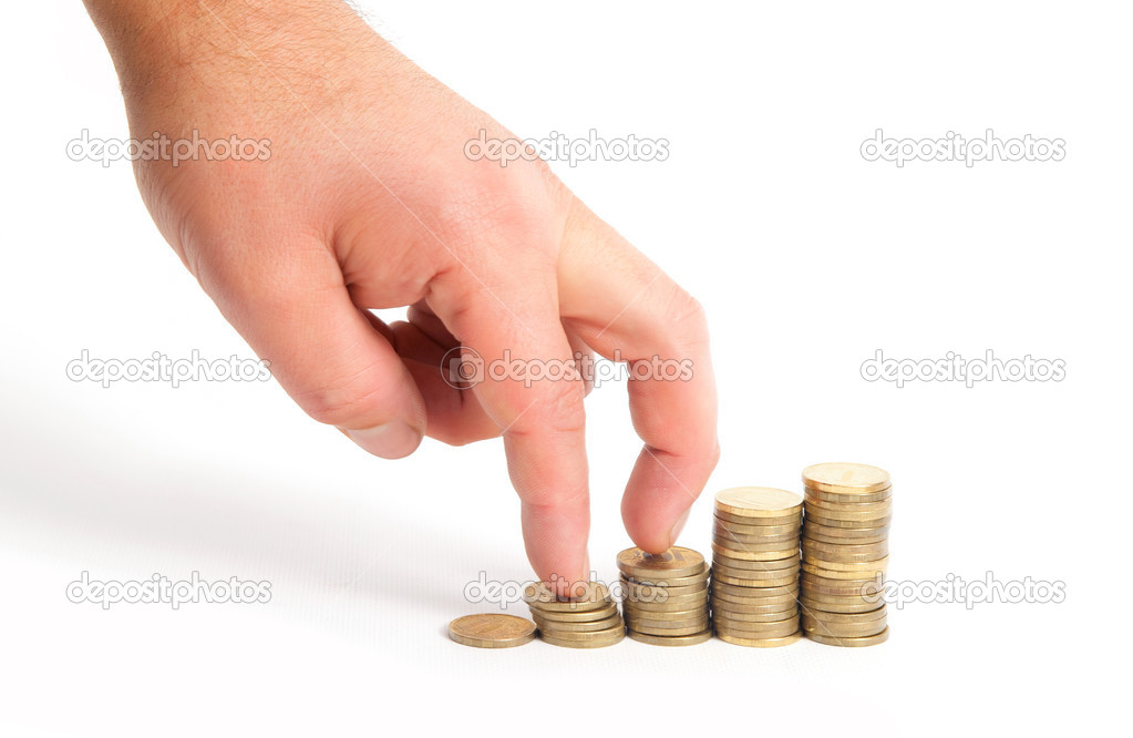 Fingers go up by stakes of coins