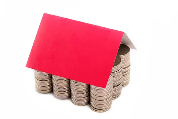 A coins house with paper roof — Stock Photo, Image