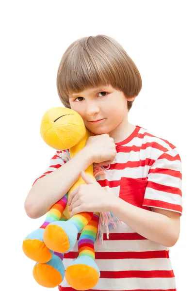 Child holds soft toy horse — Stock Photo, Image