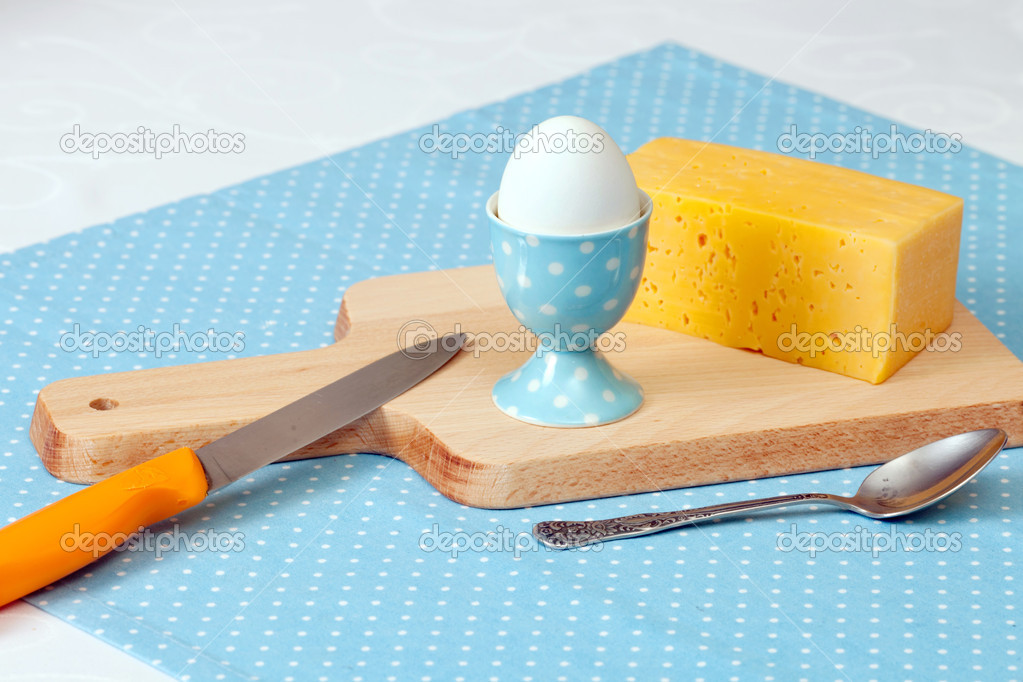 Cheese, egg on cutting board