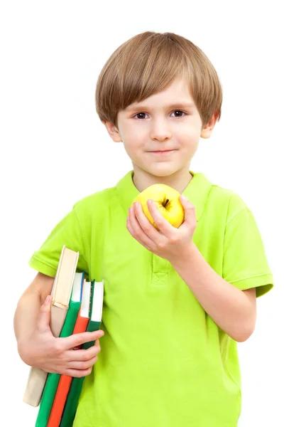 Niño con manzana y libros —  Fotos de Stock