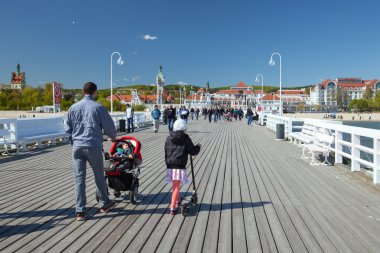 The walking family in Sopot clipart
