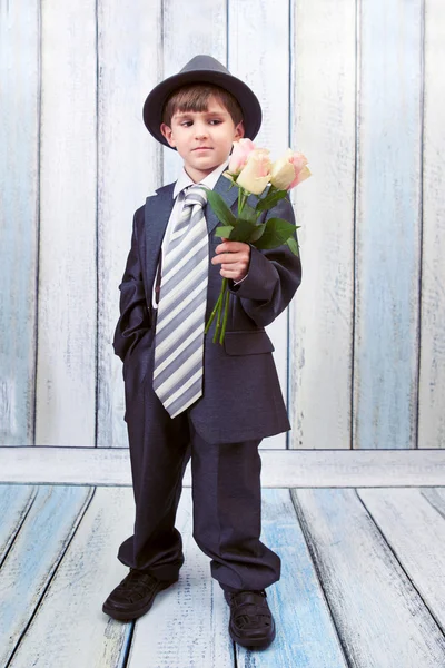 Small boy with bouquet of roses — Stock Photo, Image