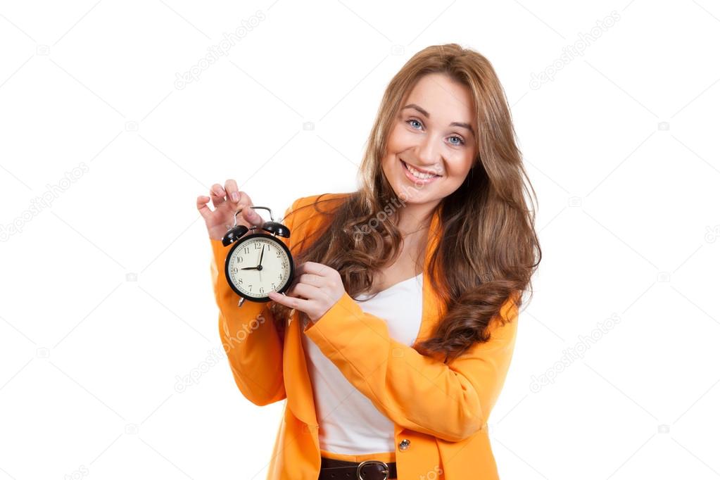 Woman pointing to an alarm clock