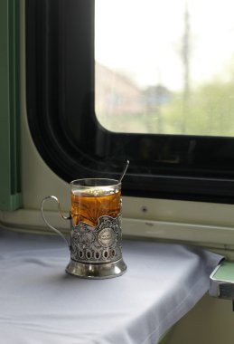 Glass of tea in train clipart