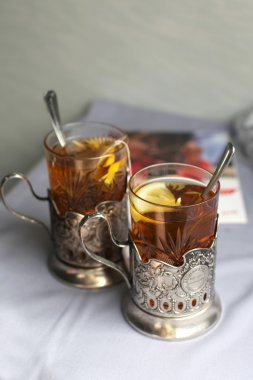 Two glasses of tea with lemon clipart