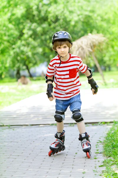 Boy is riding on rollers — Stock Photo, Image