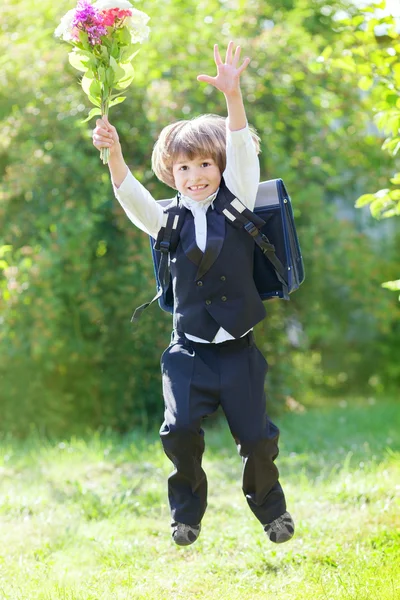 First-grader boy with bouquet — Stock Photo, Image