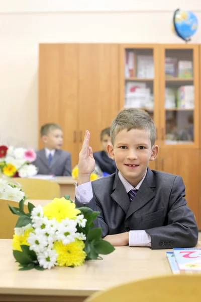 Schoolboy take up hand for answer — Stock Photo, Image