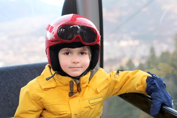 The small boy sits in cable car — Stock Photo, Image