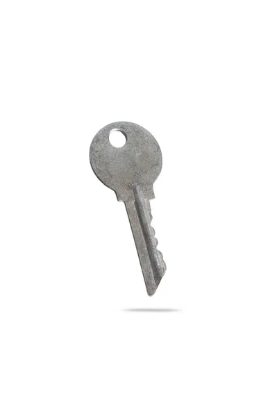 Niet nieuw, oude metalen sleutel uit appartementencomplex geïsoleerd op witte achtergrond — Stockfoto