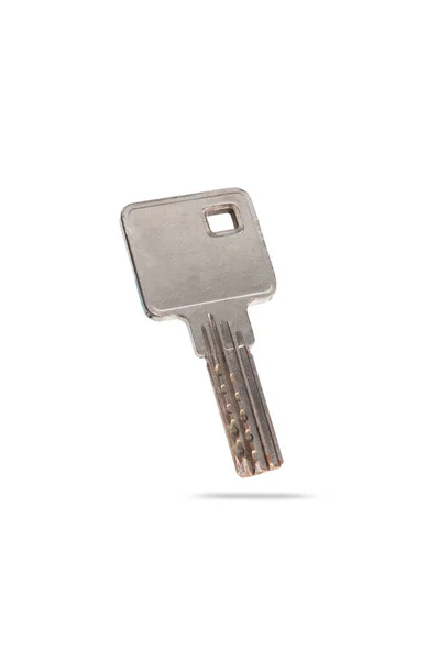 Niet nieuw, oude metalen sleutel uit appartementencomplex geïsoleerd op witte achtergrond — Stockfoto
