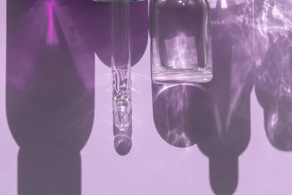 Pipette Dropper Face Serum Bottle Shadows Purple Background Your Beauty — стоковое фото