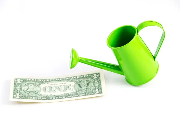 Green watering can with dollar. — Stock Photo, Image