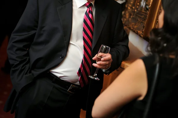 Business man with black suite and drink
