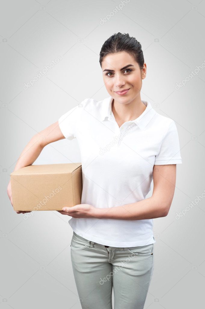Delivery woman holding a box — Stock Photo © vladteodor95 44834329