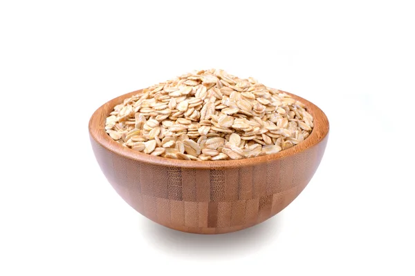 A bowl of uncooked rolled oats isolated on white background — Stock Photo, Image