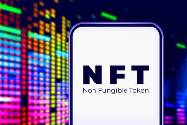 Smartphone with the acronym NFT logo refers to a non-fungible token, which refers to a digital asset that cannot be consumed or replaced.United States New York, January 18, 2022 clipart
