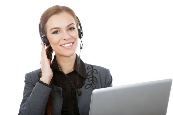 Bild av leende kvinnliga hjälptelefon operatör med hörlurar och — Stockfoto