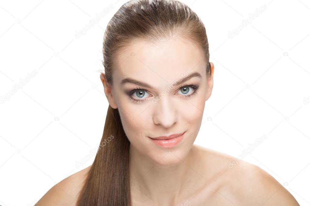 Portrait of a smiling woman with clean skin, isoleted on white b