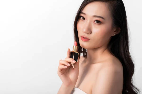 Portrait of Attractive Beauty Asian Woman in Fashion Posing with Lipstick , Wearing White Dress on White Background for Cosmetic or Health Media